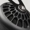 Close-up of open-back earcup grille on Meze 105 AER