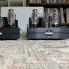 Cary Audio CAD-211FE monoblocks positioned on the floor, connected to a high-end system.