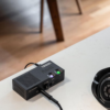 Chord Electronics Anni on a desk with connected headphones