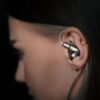 Meze Astru headphones. Girl wears Meze Audio Astru headphones