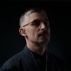 Man listens to music with Meze Astru IEMs